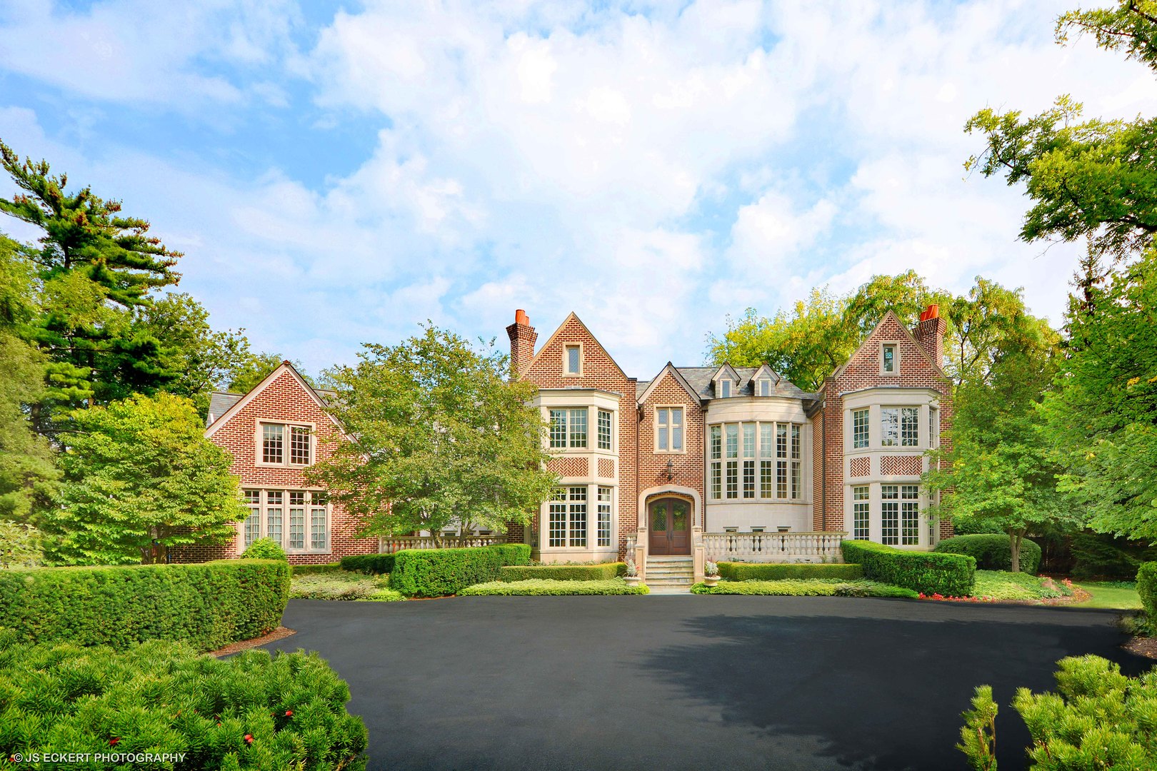 front view of a house with a garden