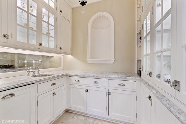 a view of a hallway with closet and bathroom