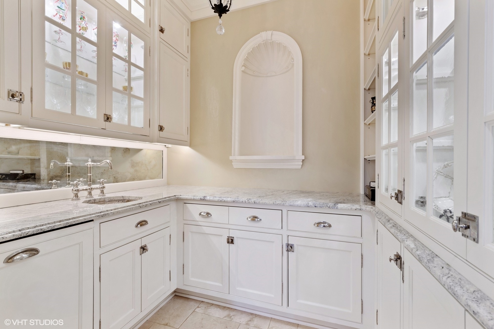 1451 North Green Bay Road Lake Forest, IL 60045 - Photo 14 of 55 a kitchen with white cabinets and a sink