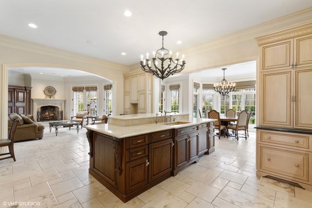 a kitchen with stove and cabinets