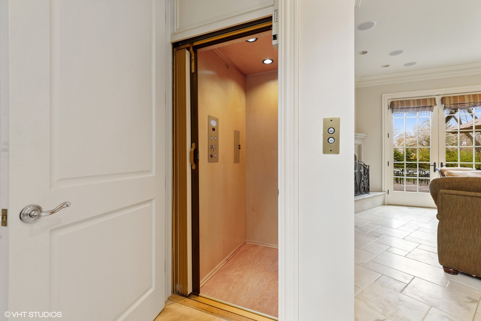 1451 North Green Bay Road Lake Forest, IL 60045 - Photo 23 of 55 a view of a hallway with a glass door and a bathroom