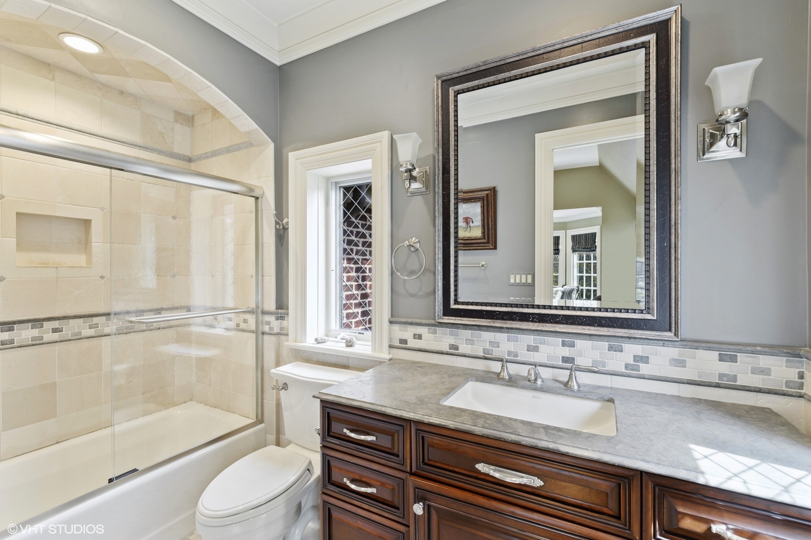 1451 North Green Bay Road Lake Forest, IL 60045 - Photo 26 of 55 a bathroom with a granite countertop sink a mirror and a bathtub