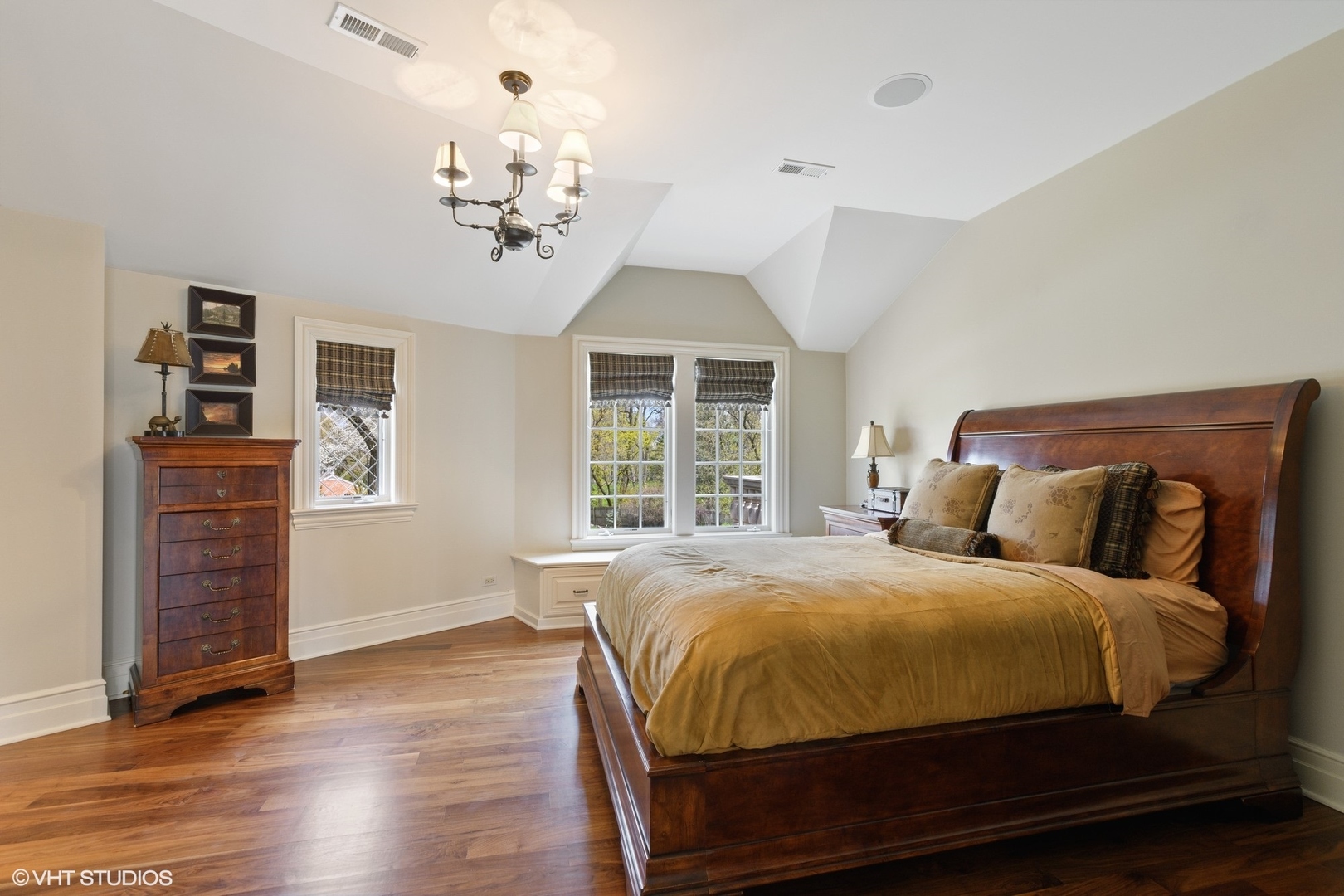 1451 North Green Bay Road Lake Forest, IL 60045 - Photo 36 of 55 a bedroom with a large bed and a chandelier