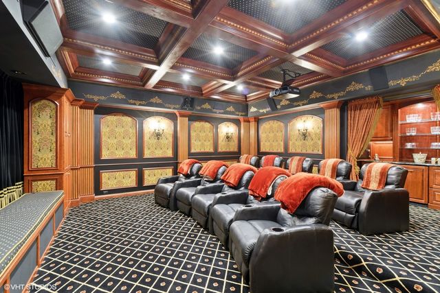 a bathroom with a glass shower door and a mirror