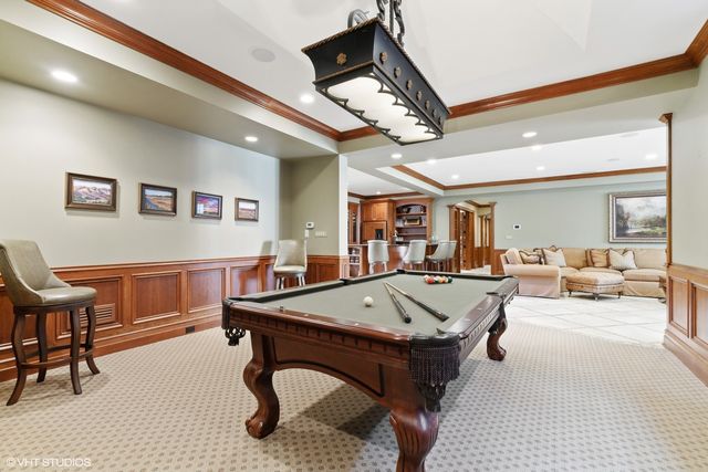 a view of a table and chairs under an umbrella