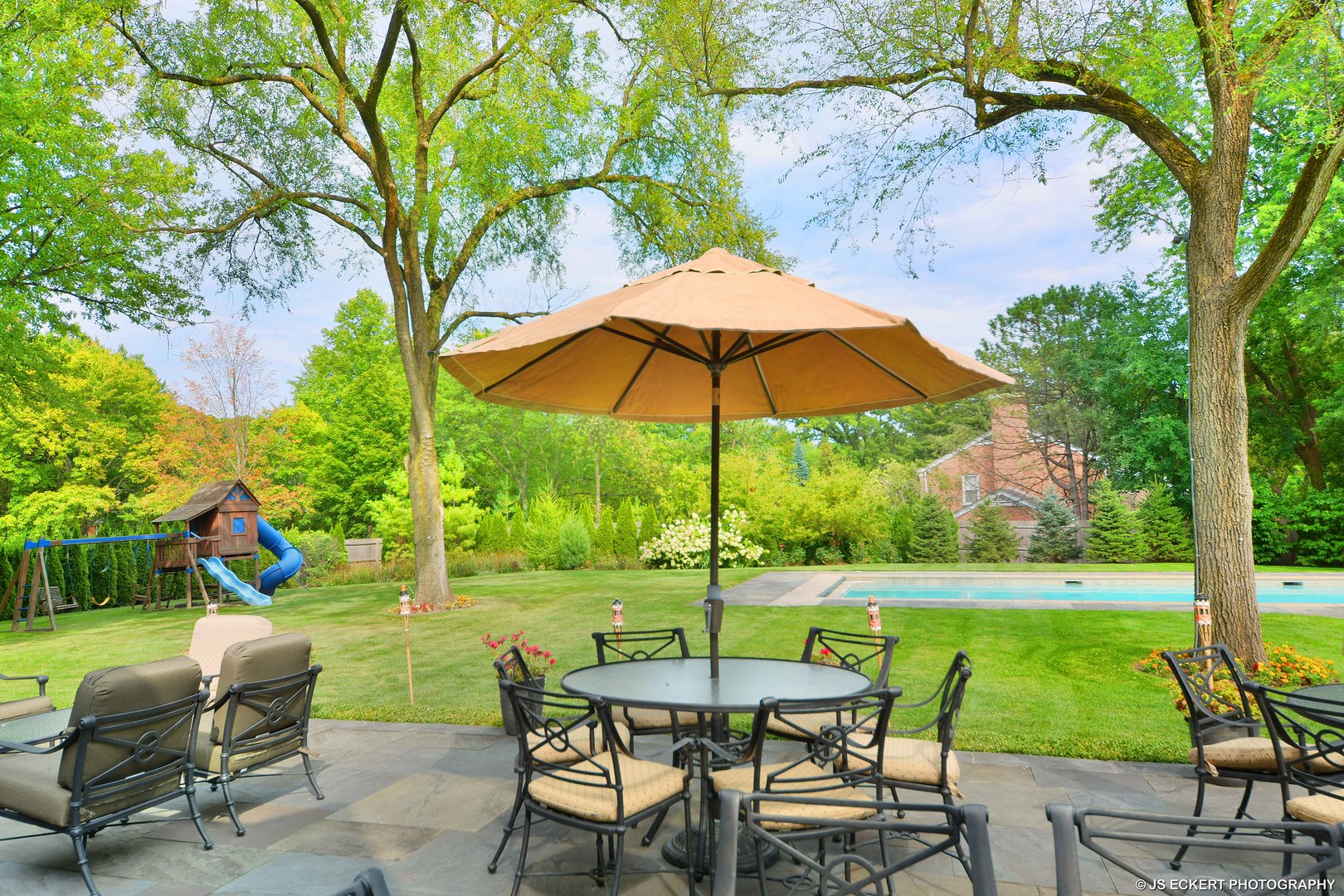 1451 North Green Bay Road Lake Forest, IL 60045 - Photo 54 of 55 a view of a table and chairs under an umbrella