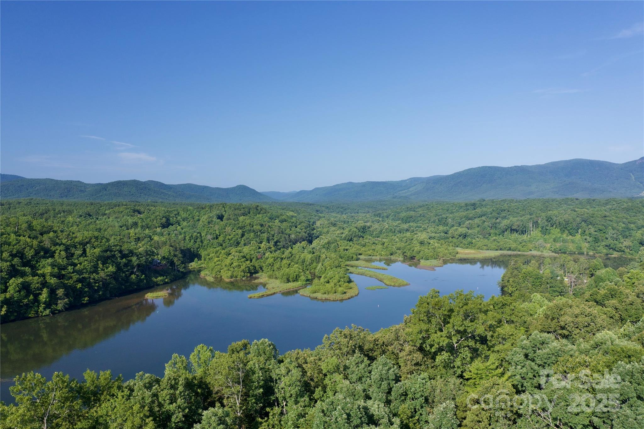 0 Parkway North None Mill Spring, Unit 13 Mill Spring, NC 28756 - Photo 1 of 8 a view of lake with mountain