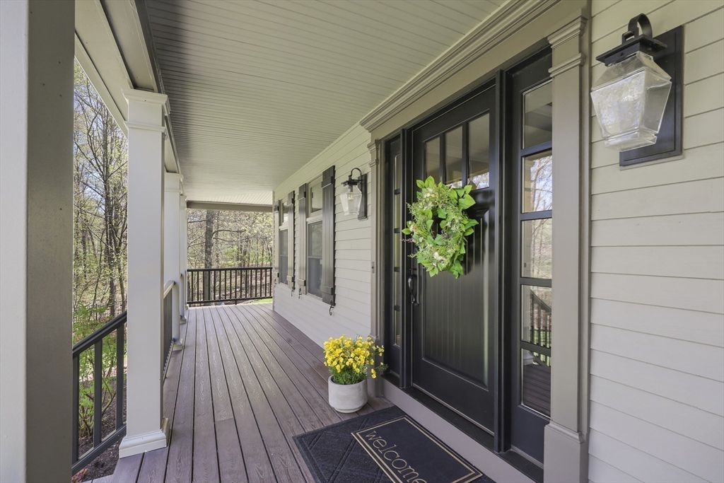 52 Fales Road Plainville, MA 02762 - Photo 9 of 41 a porch with wooden floor
