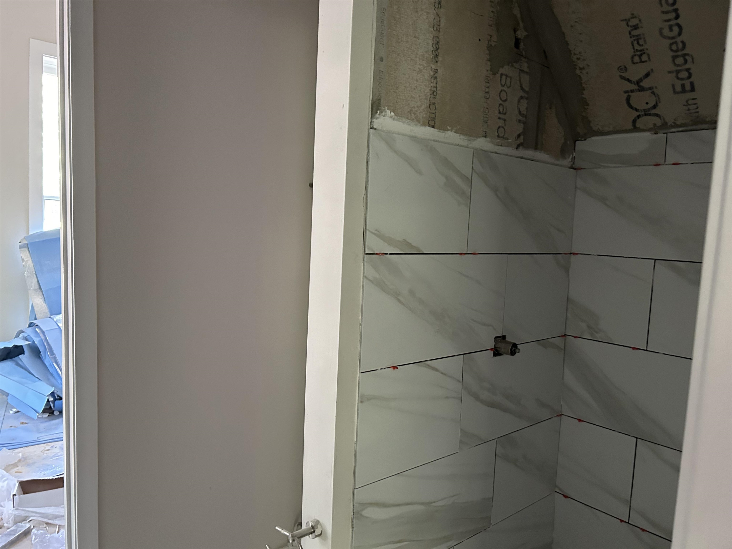 605 Byars Street Covington, TN 38019 - Photo 7 of 11 a bathroom with a shower and a glass door