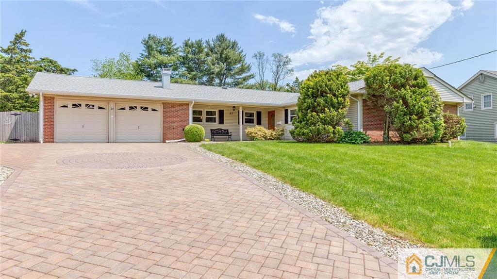 23 Johnson Road Somerset, NJ 08873 - Photo 1 of 12 a front view of a house with a yard and garage