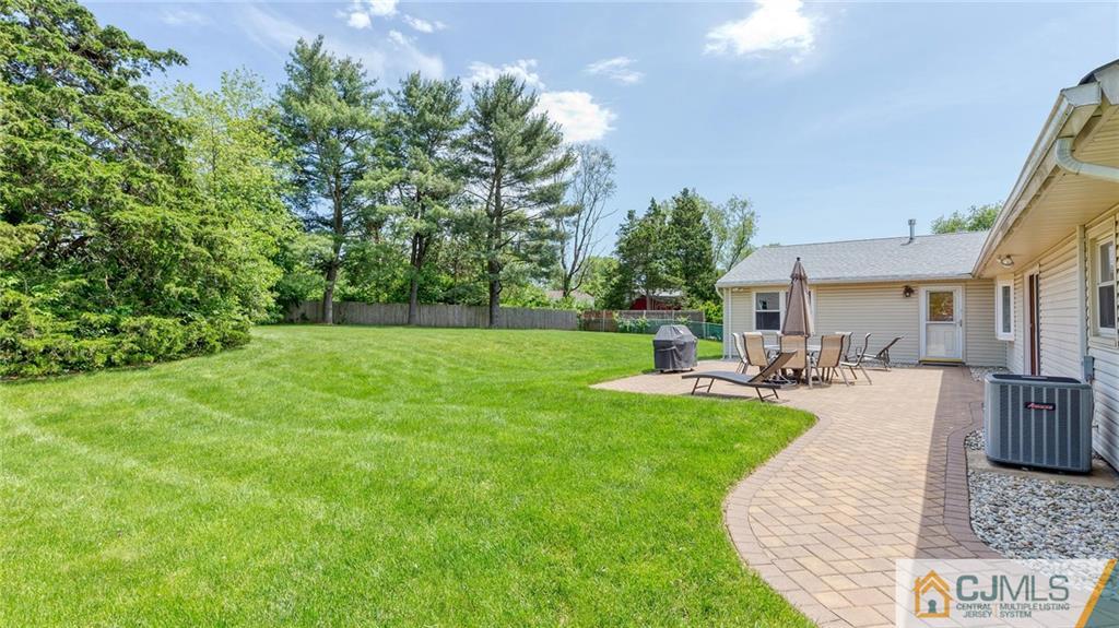 23 Johnson Road Somerset, NJ 08873 - Photo 9 of 12 a view of a house with backyard porch and sitting area