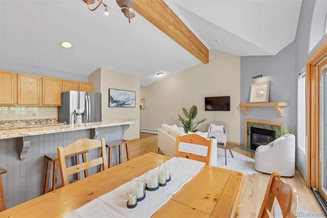 a living room with furniture fireplace and flat screen tv