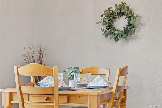 a view of dining room and kitchen with furniture