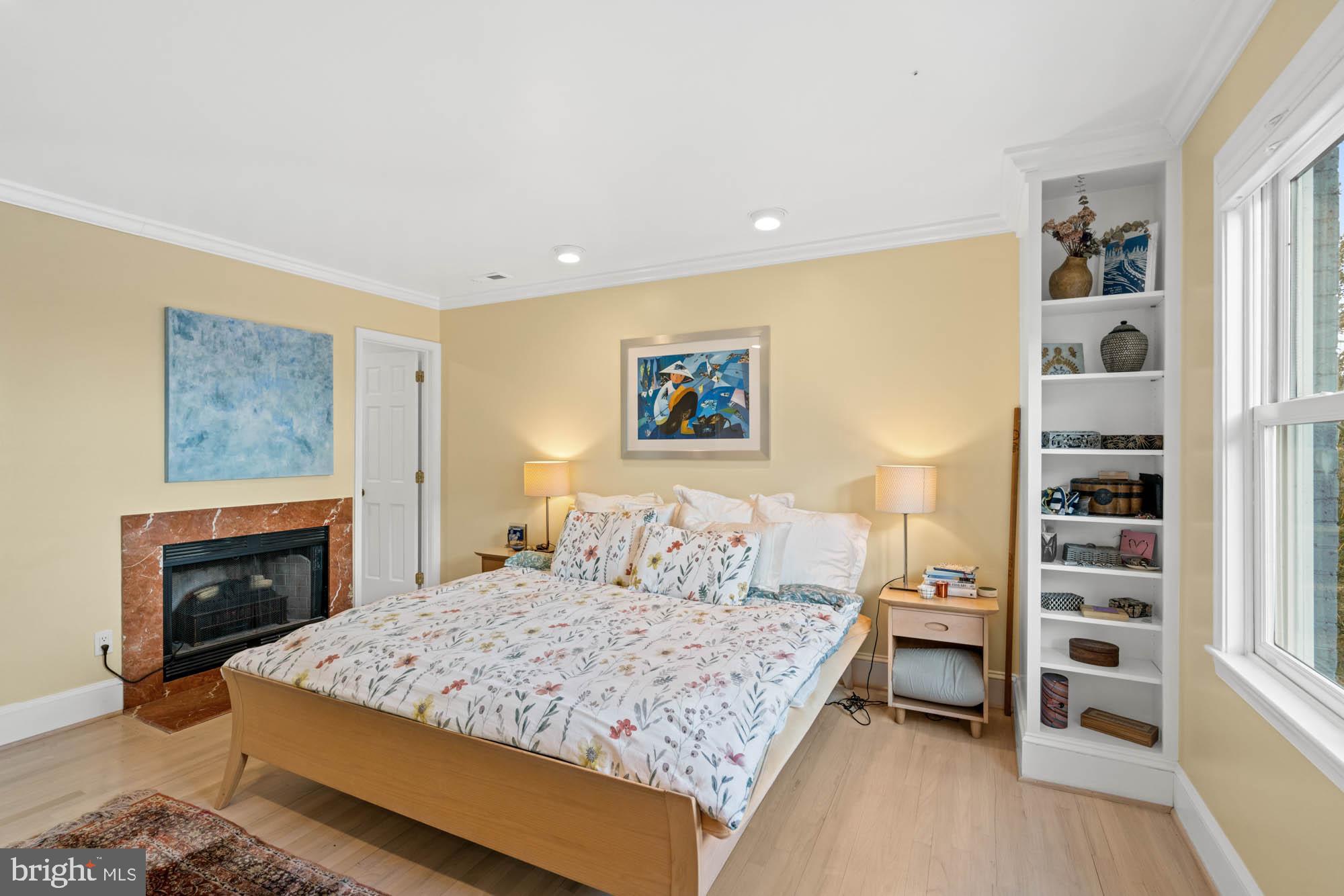 3507 R Street Northwest Washington, DC 20007 - Photo 47 of 71 Primary bedroom with wood burning fire place