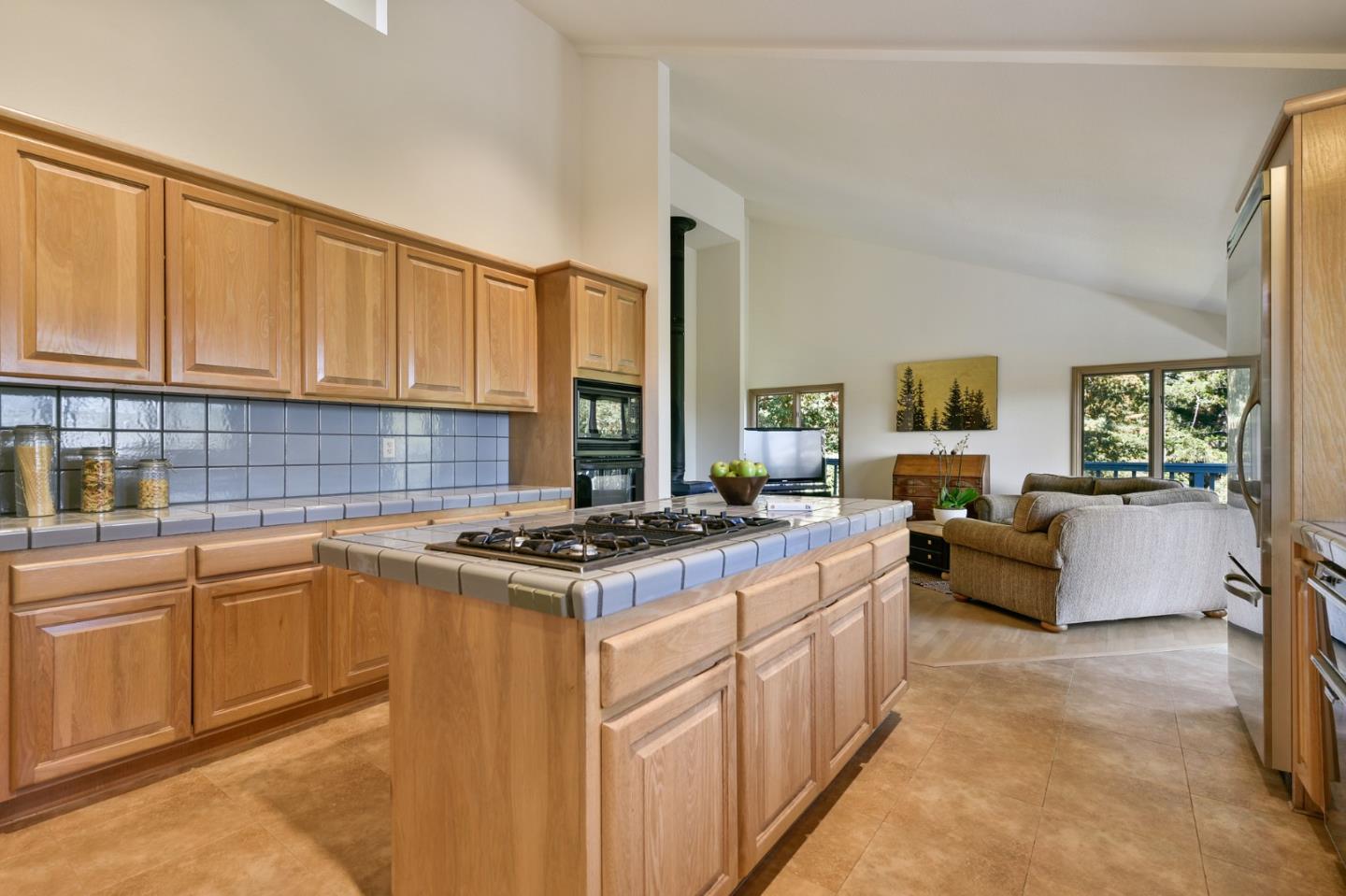 255 Allen Road Woodside, CA 94062 - Photo 13 of 43 a kitchen with stainless steel appliances granite countertop a stove top oven a sink dishwasher and white cabinets