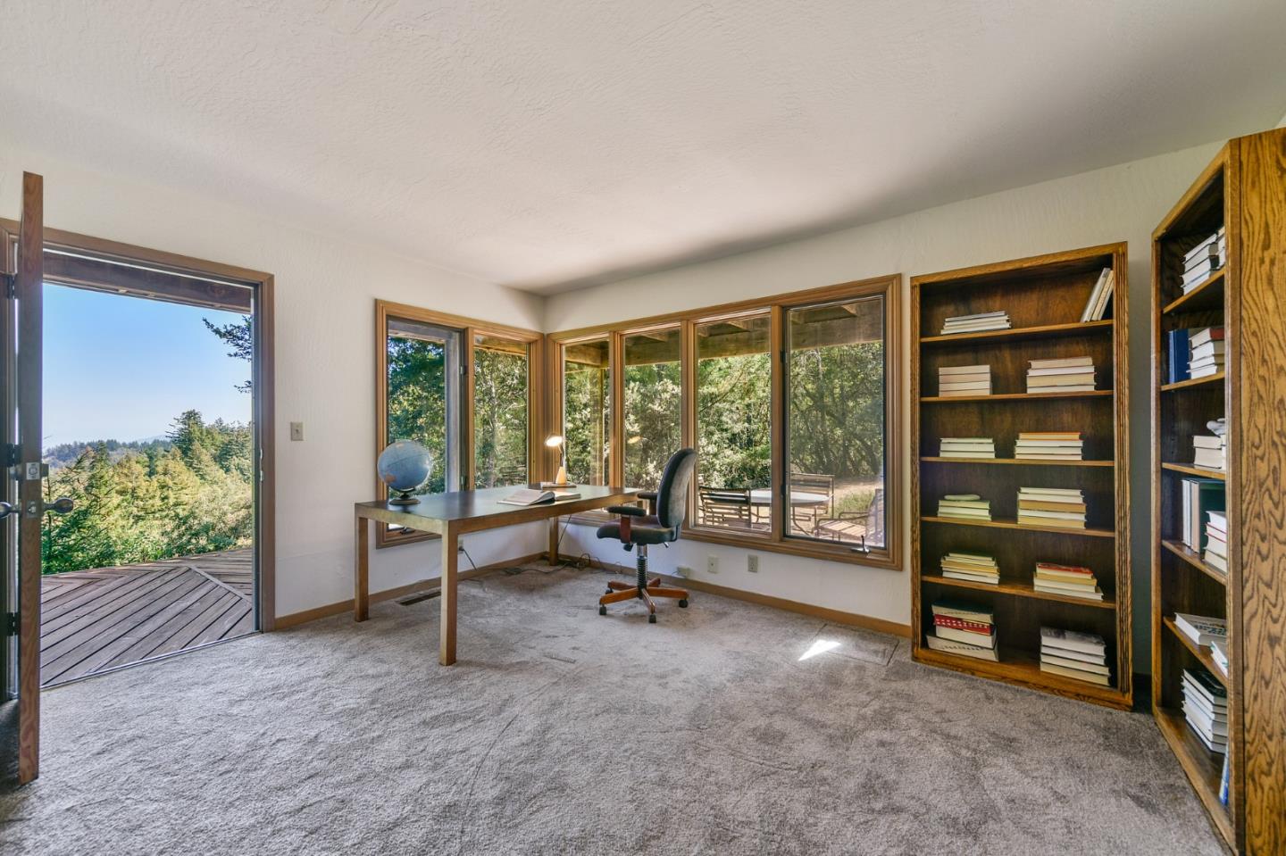 255 Allen Road Woodside, CA 94062 - Photo 17 of 43 a living room with furniture and a floor to ceiling window
