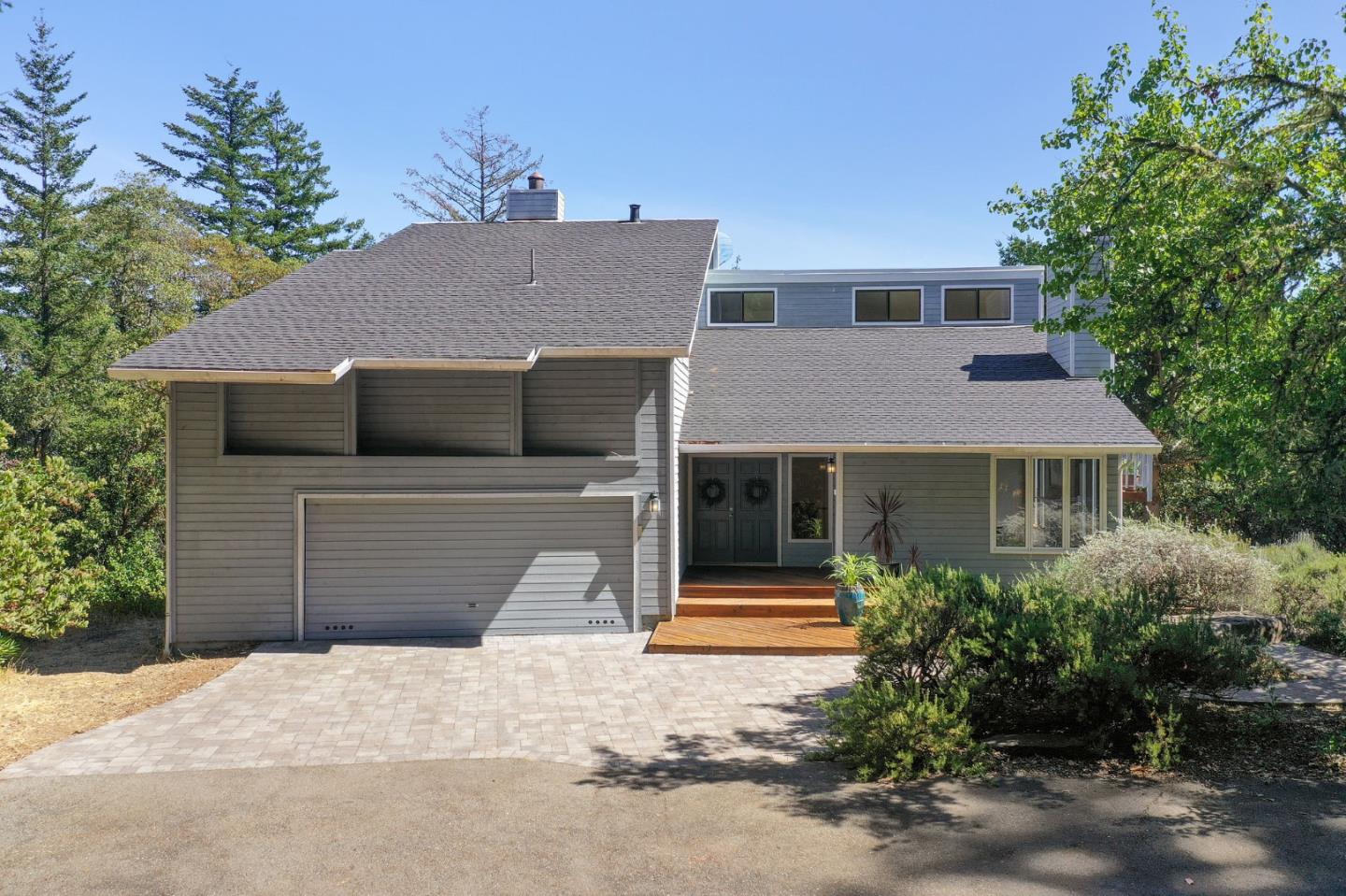 255 Allen Road Woodside, CA 94062 - Photo 2 of 43 a front view of a house with a yard and garage