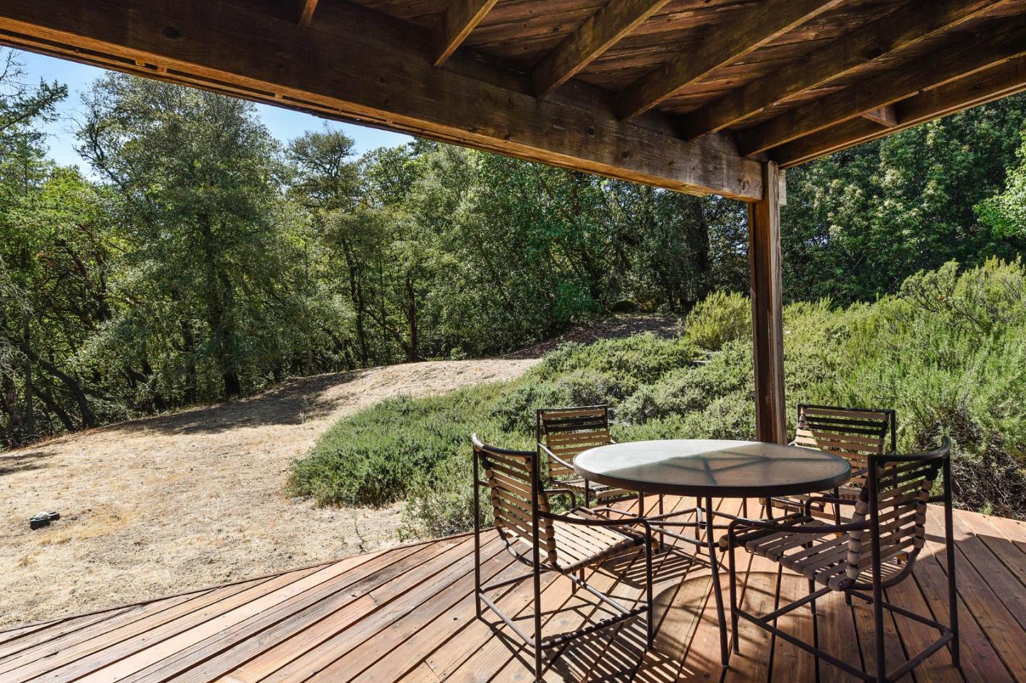 255 Allen Road Woodside, CA 94062 - Photo 29 of 43 a view of a chairs and table in the patio