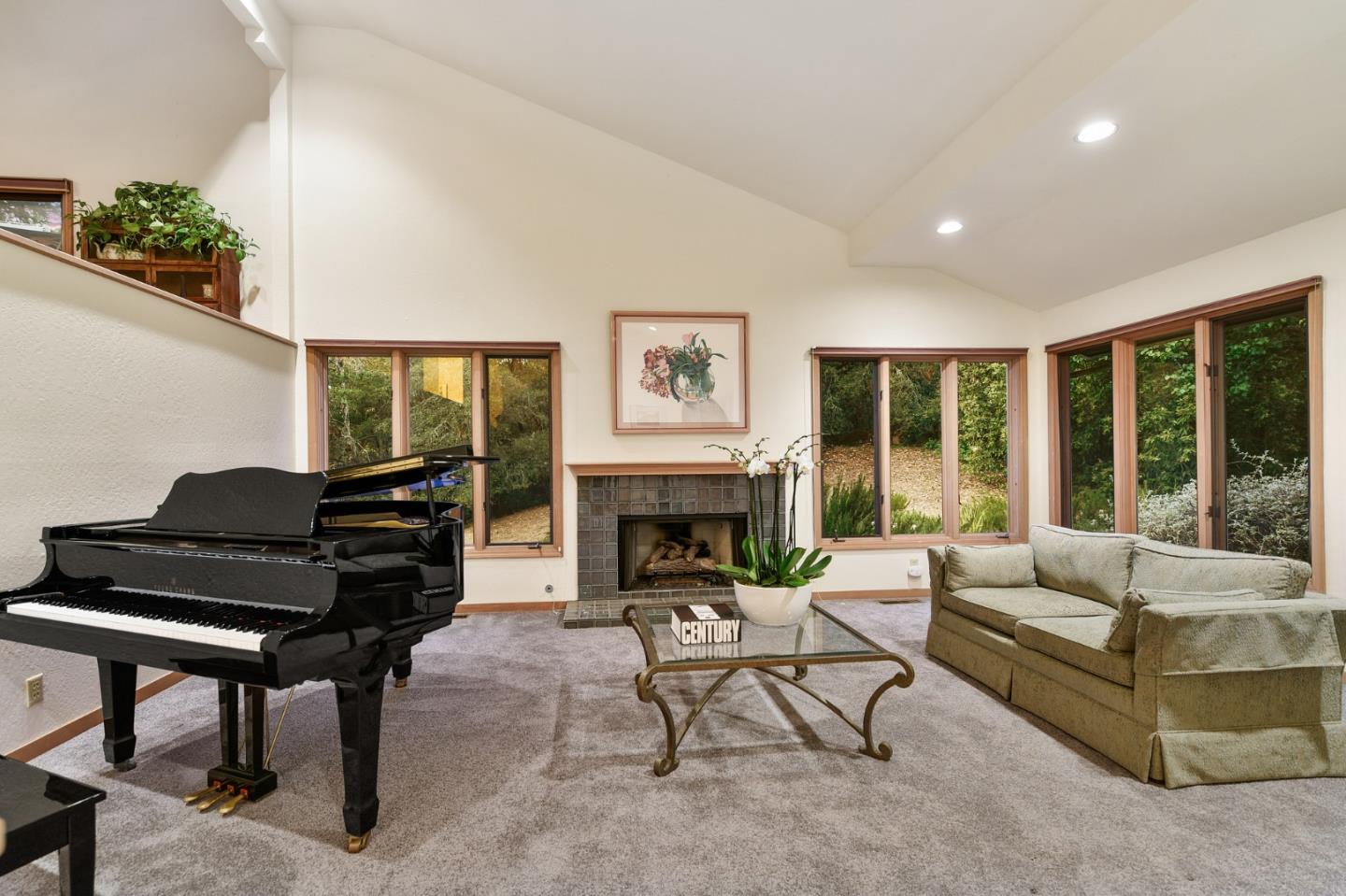 255 Allen Road Woodside, CA 94062 - Photo 41 of 43 a living room with furniture a fireplace and a floor to ceiling window