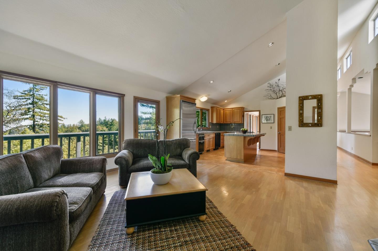255 Allen Road Woodside, CA 94062 - Photo 10 of 43 a living room with furniture wooden floor and a large window