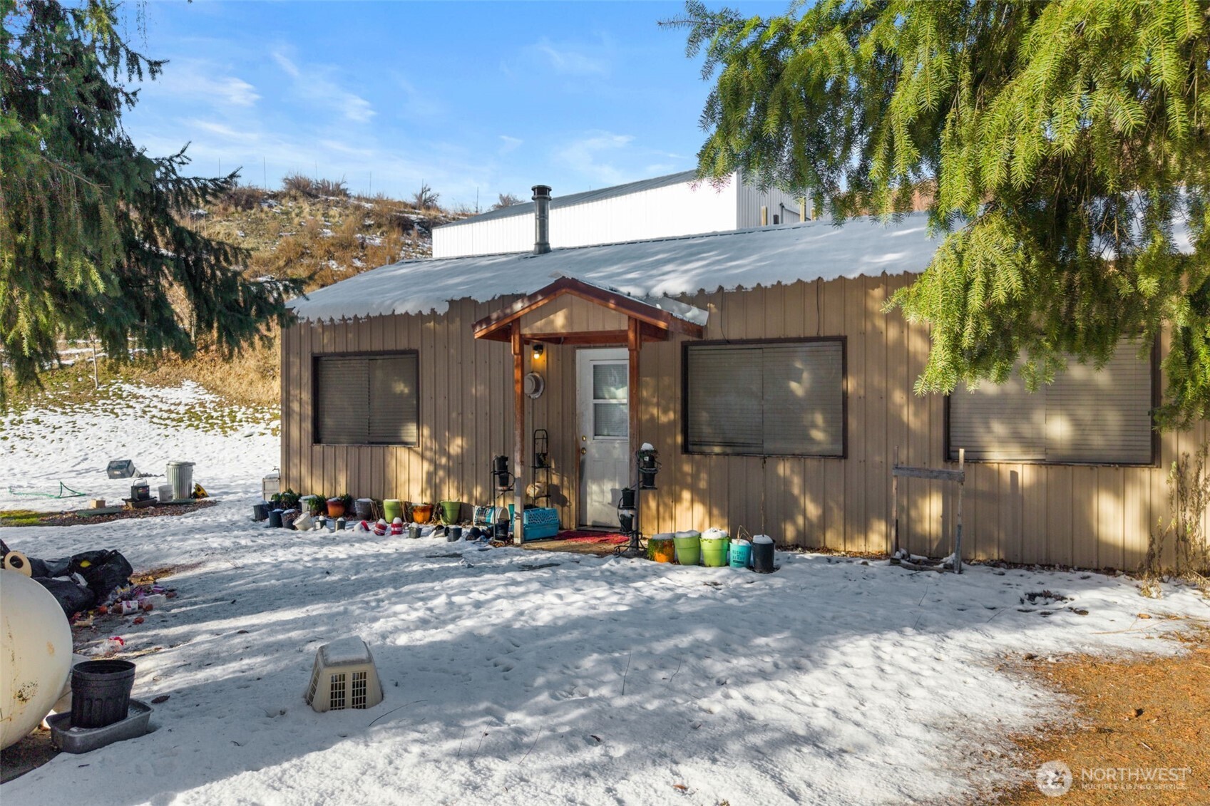 762 Boyd Loop Road Manson, WA 98831 - Photo 17 of 33 a front view of a building with sitting area