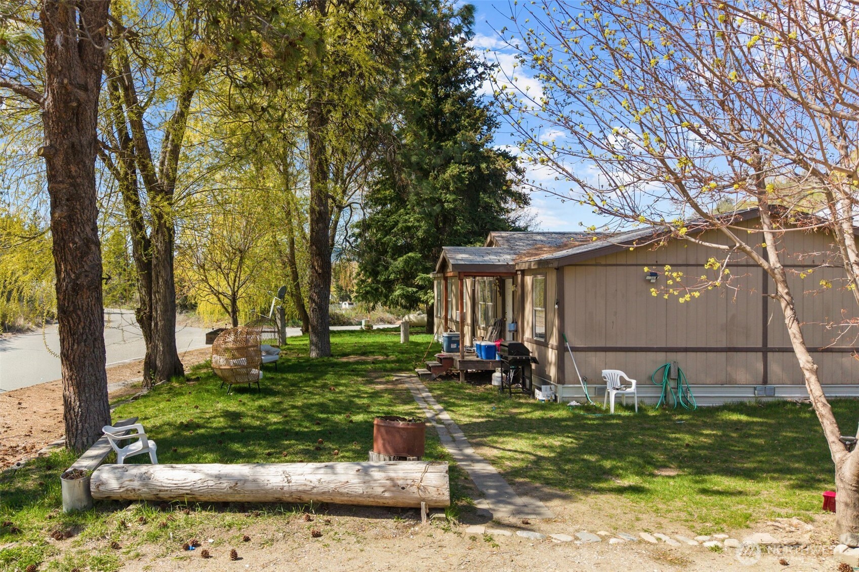 762 Boyd Loop Road Manson, WA 98831 - Photo 2 of 33 a front view of a house with garden
