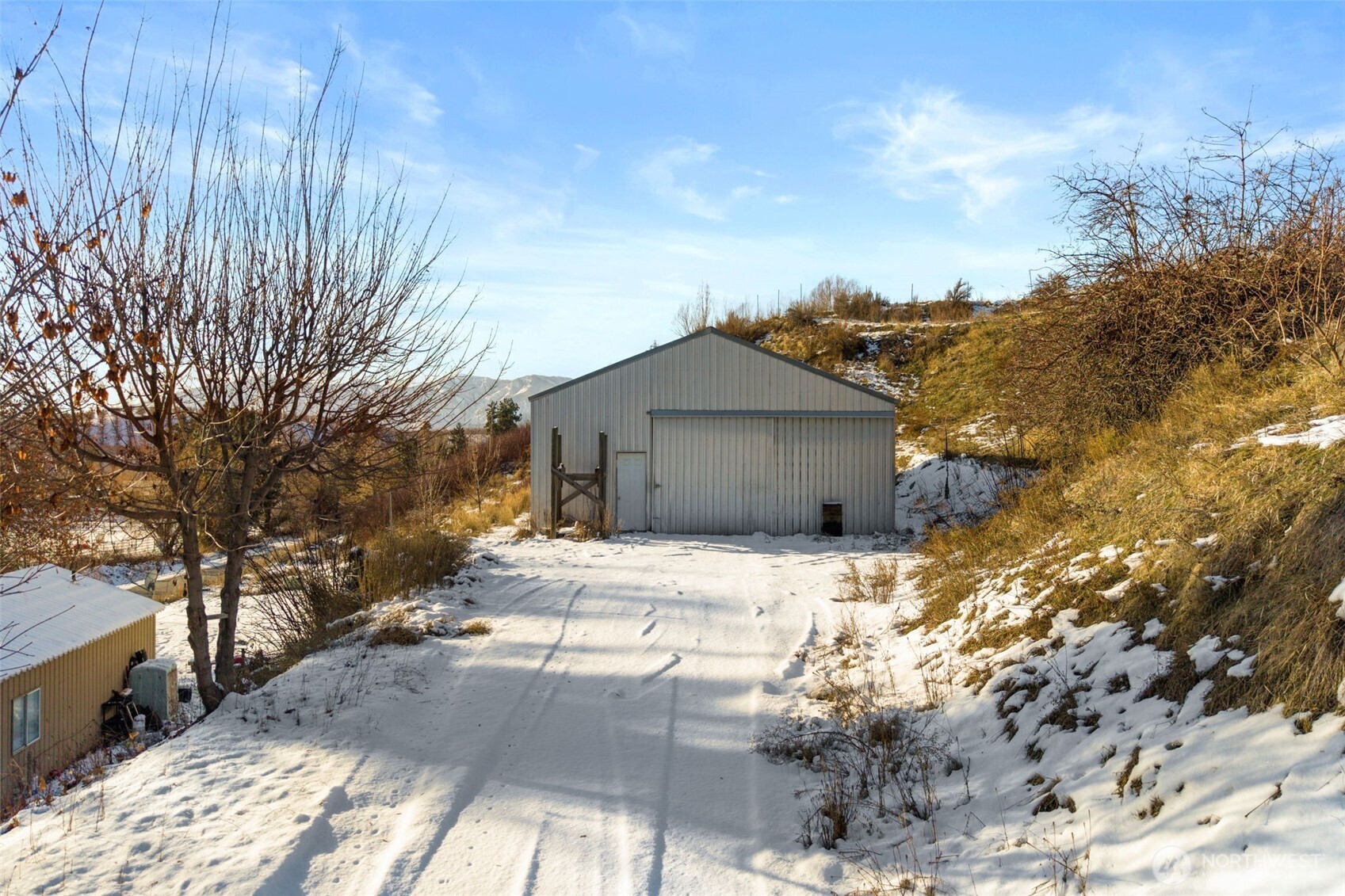 762 Boyd Loop Road Manson, WA 98831 - Photo 5 of 19 a wooden house with trees in front of it