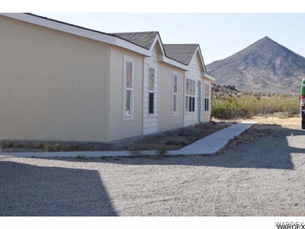 5807 Davis Road Golden Valley, AZ 86413 - Photo 2 of 17 a view of a house with a yard