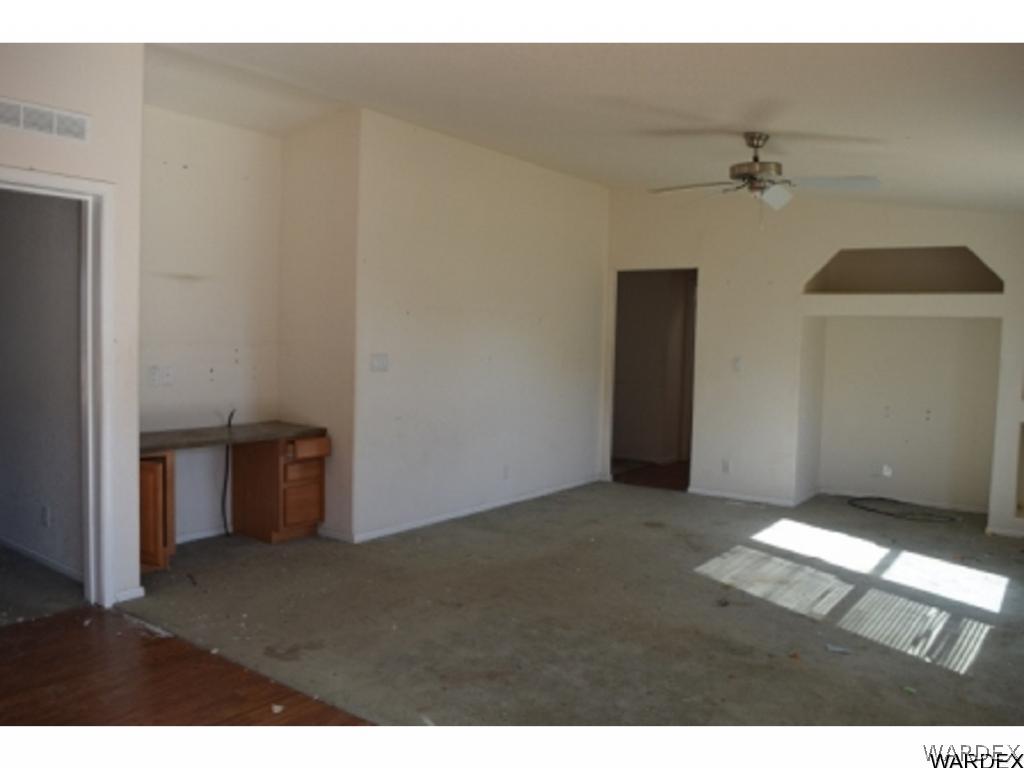 5807 Davis Road Golden Valley, AZ 86413 - Photo 9 of 17 a view of an empty room with a ceiling fan