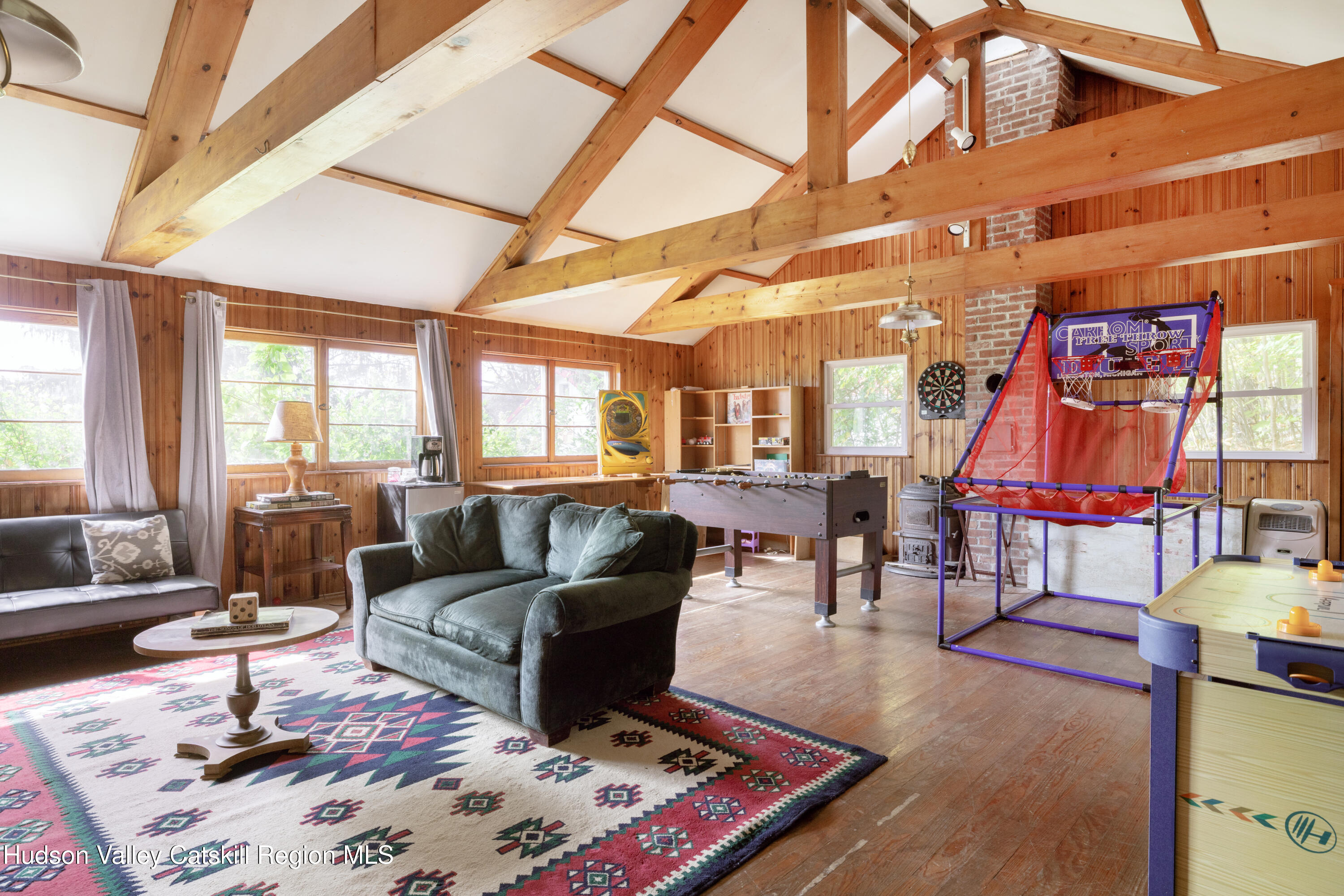 76 Smith Road Preston Hollow, NY 12469 - Photo 29 of 51 a living room with furniture a rug and a table