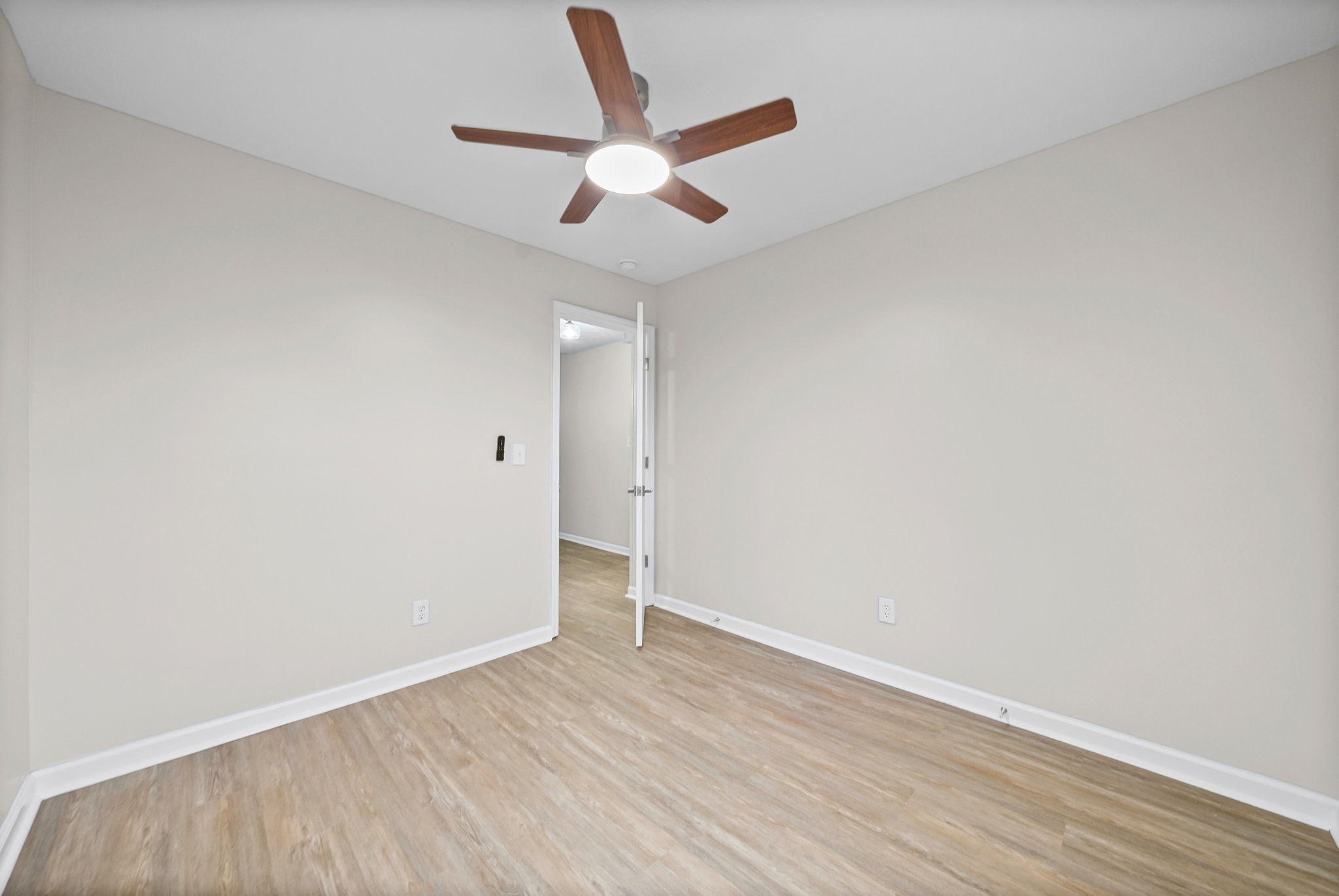 1272 Taylortown Road White Bluff, TN 37187 - Photo 20 of 39 an empty room with wooden floor and ceiling fan