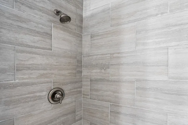 a bed room with a bed and a window