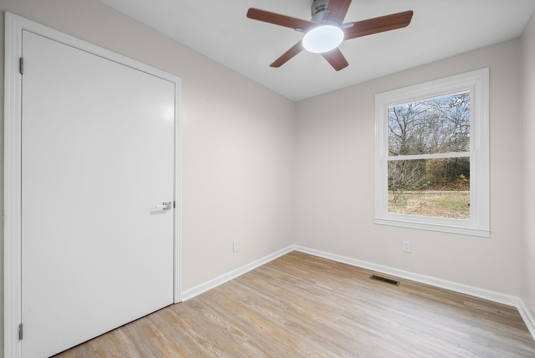 1272 Taylortown Road White Bluff, TN 37187 - Photo 27 of 39 an empty room with a window and wooden floor