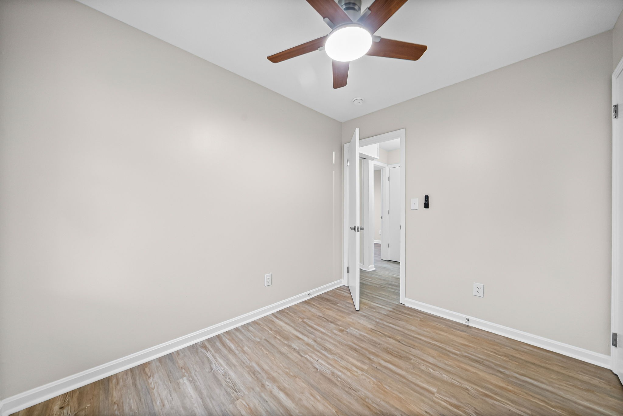 1272 Taylortown Road White Bluff, TN 37187 - Photo 28 of 39 an empty room with wooden floor and windows