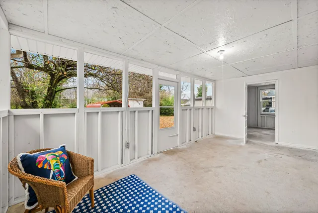 a view of an empty room with a window