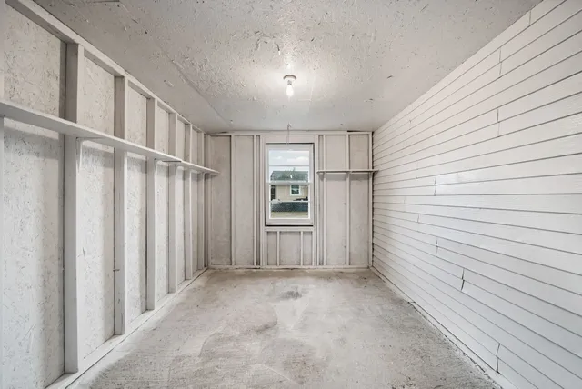 a backyard of a house with lots of green space and fountain