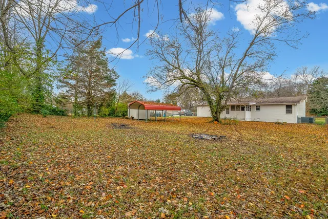 a view of a yard with an outdoor space
