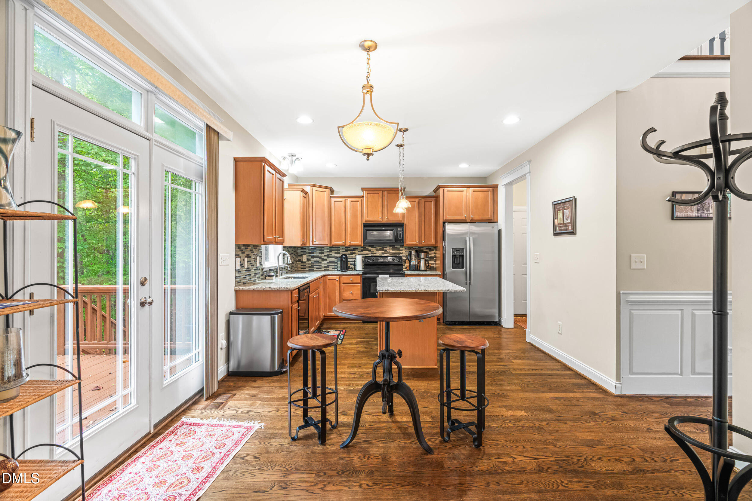 126 Geranium Way Clayton, NC 27527 - Photo 11 of 35 a view of a dining room with furniture window and wooden floor