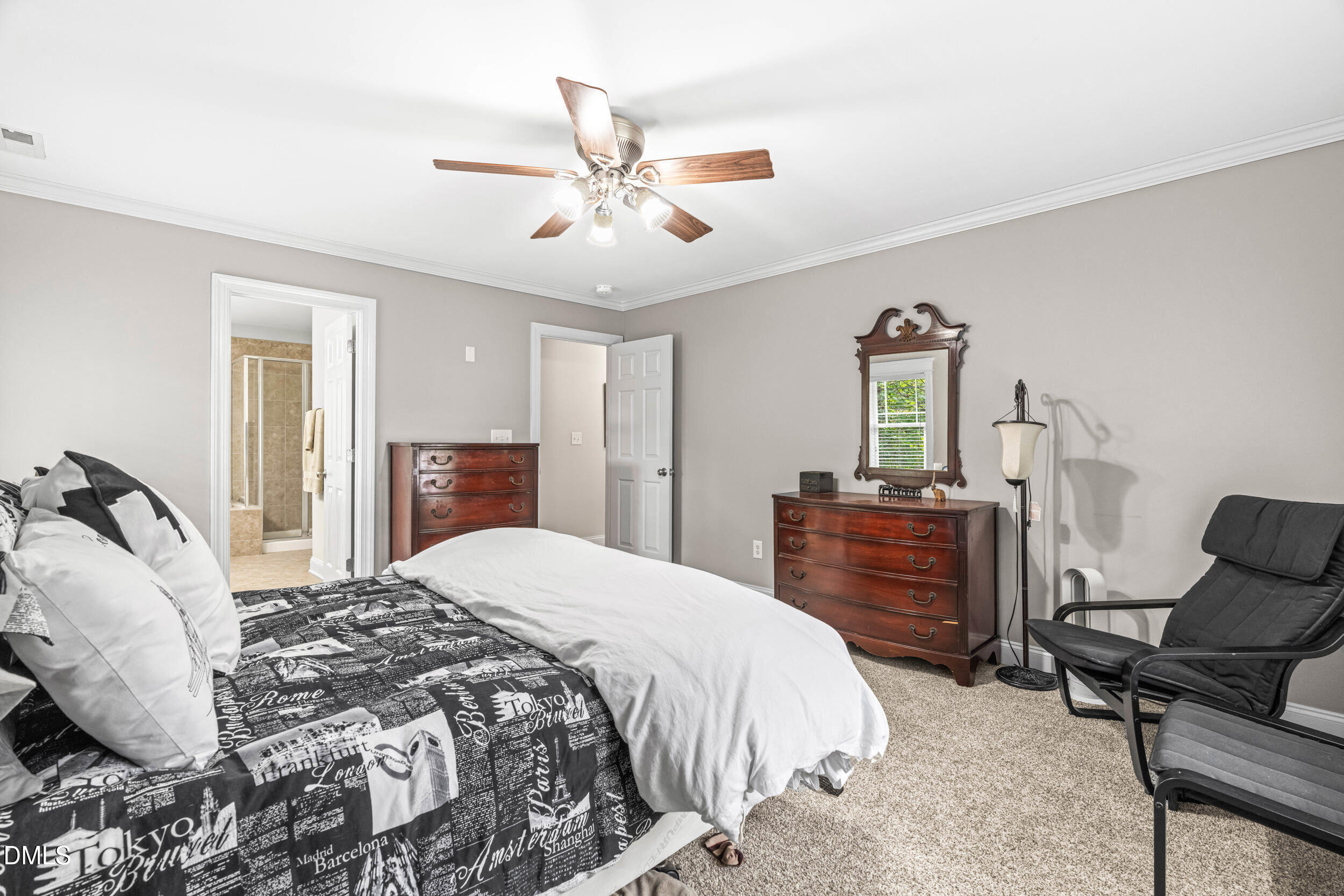 126 Geranium Way Clayton, NC 27527 - Photo 20 of 35 a bedroom with a bed and wooden floor