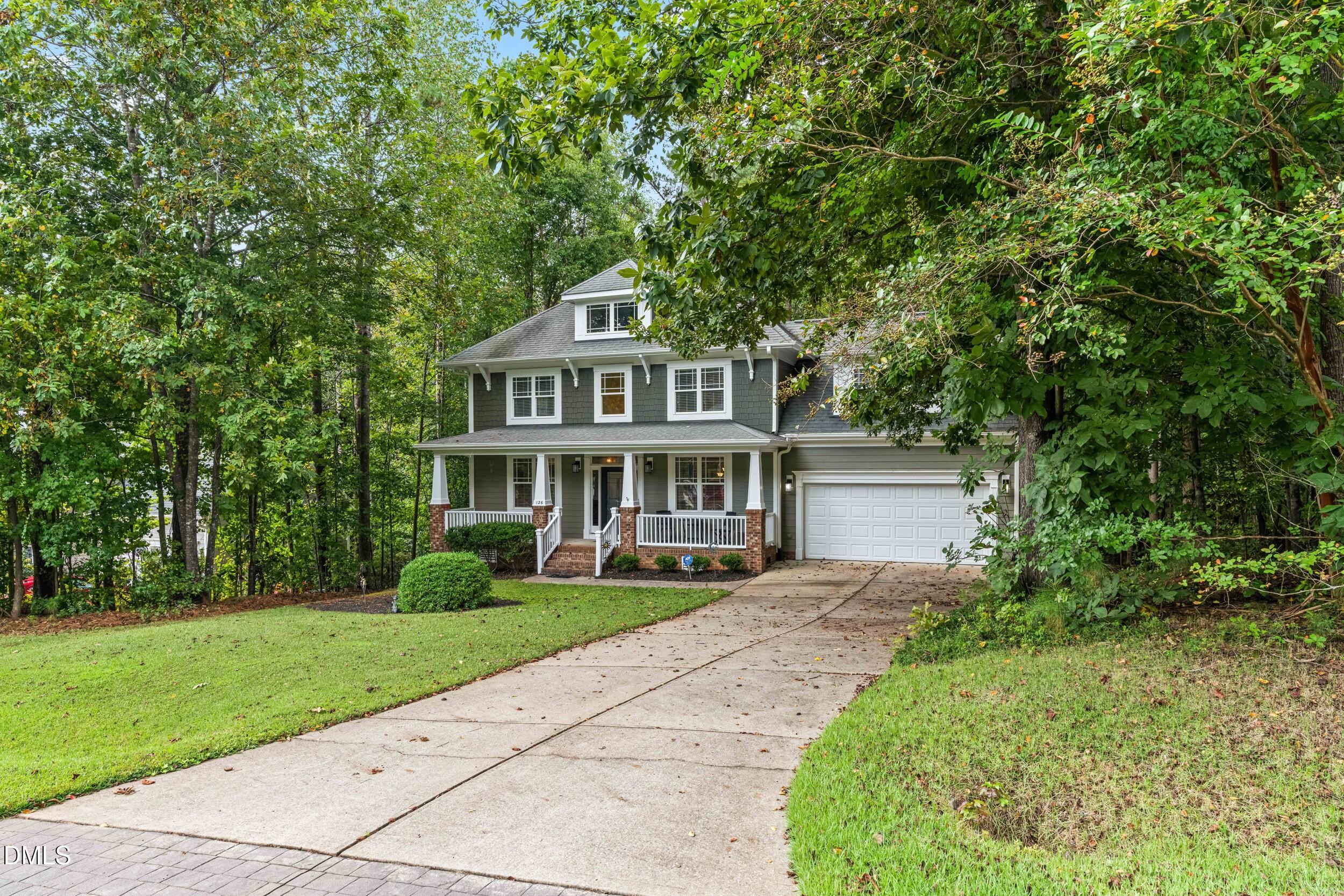 126 Geranium Way Clayton, NC 27527 - Photo 2 of 35 a front view of a house with a yard