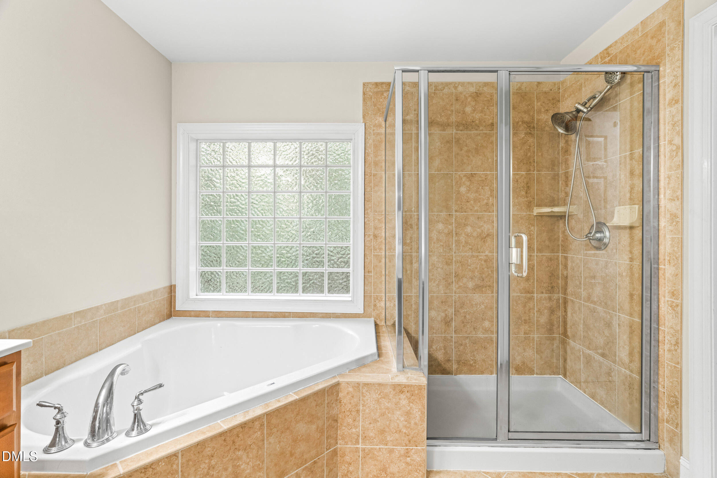 126 Geranium Way Clayton, NC 27527 - Photo 22 of 35 a bathroom with a bathtub and a shower