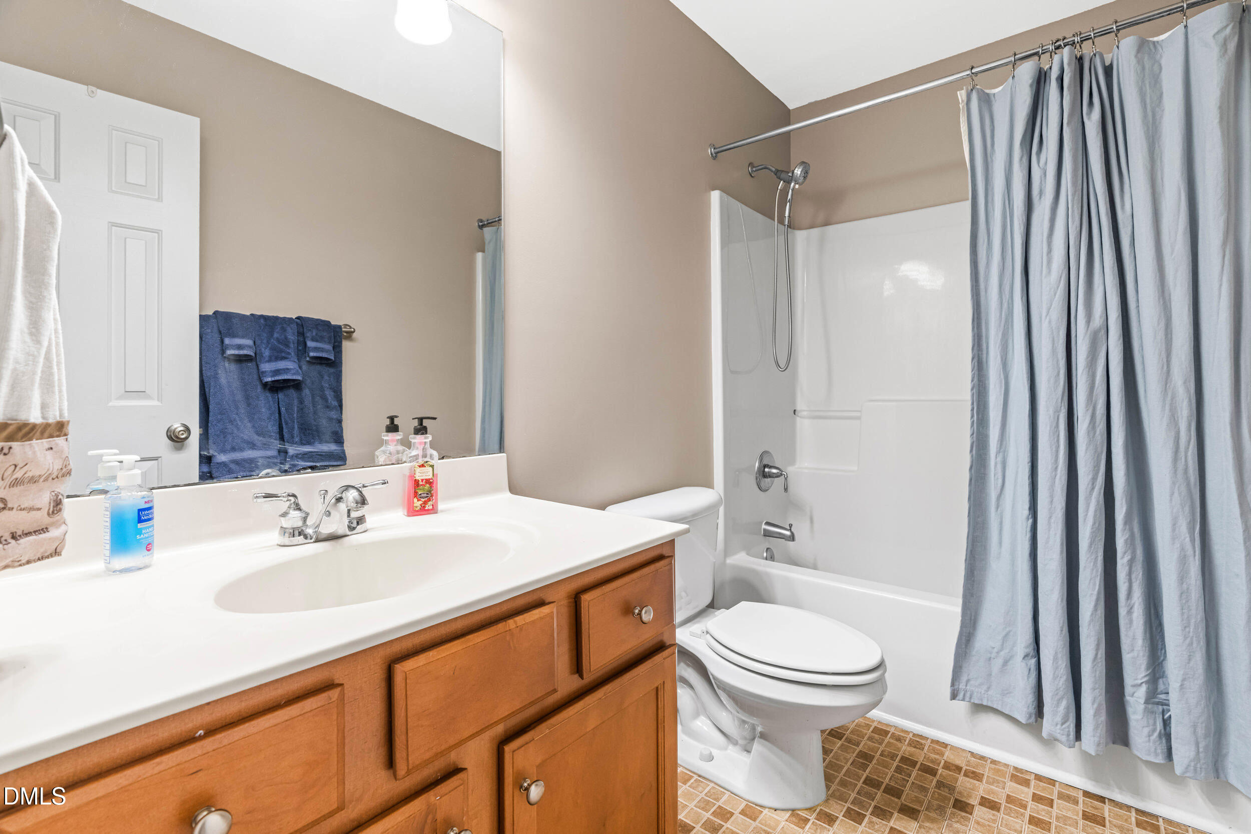 126 Geranium Way Clayton, NC 27527 - Photo 25 of 35 a bathroom with a sink a toilet and shower