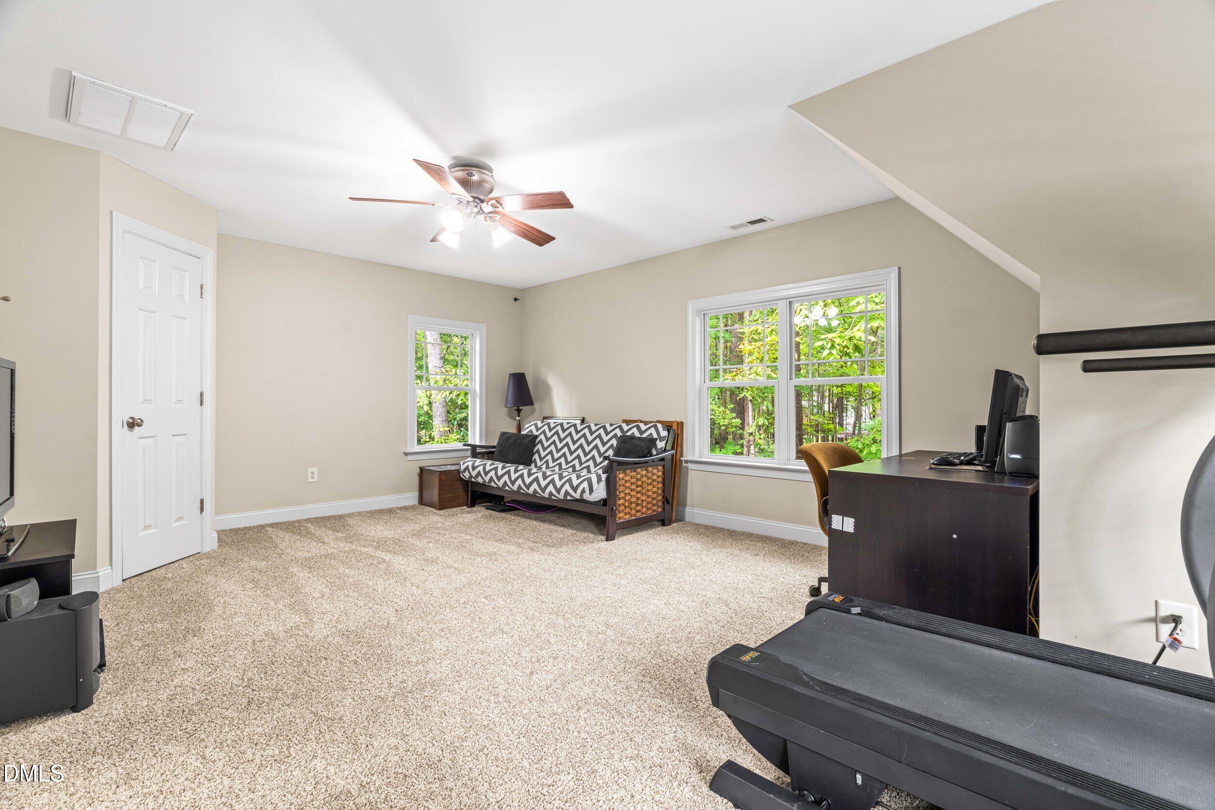 126 Geranium Way Clayton, NC 27527 - Photo 27 of 35 a living room with furniture and a window