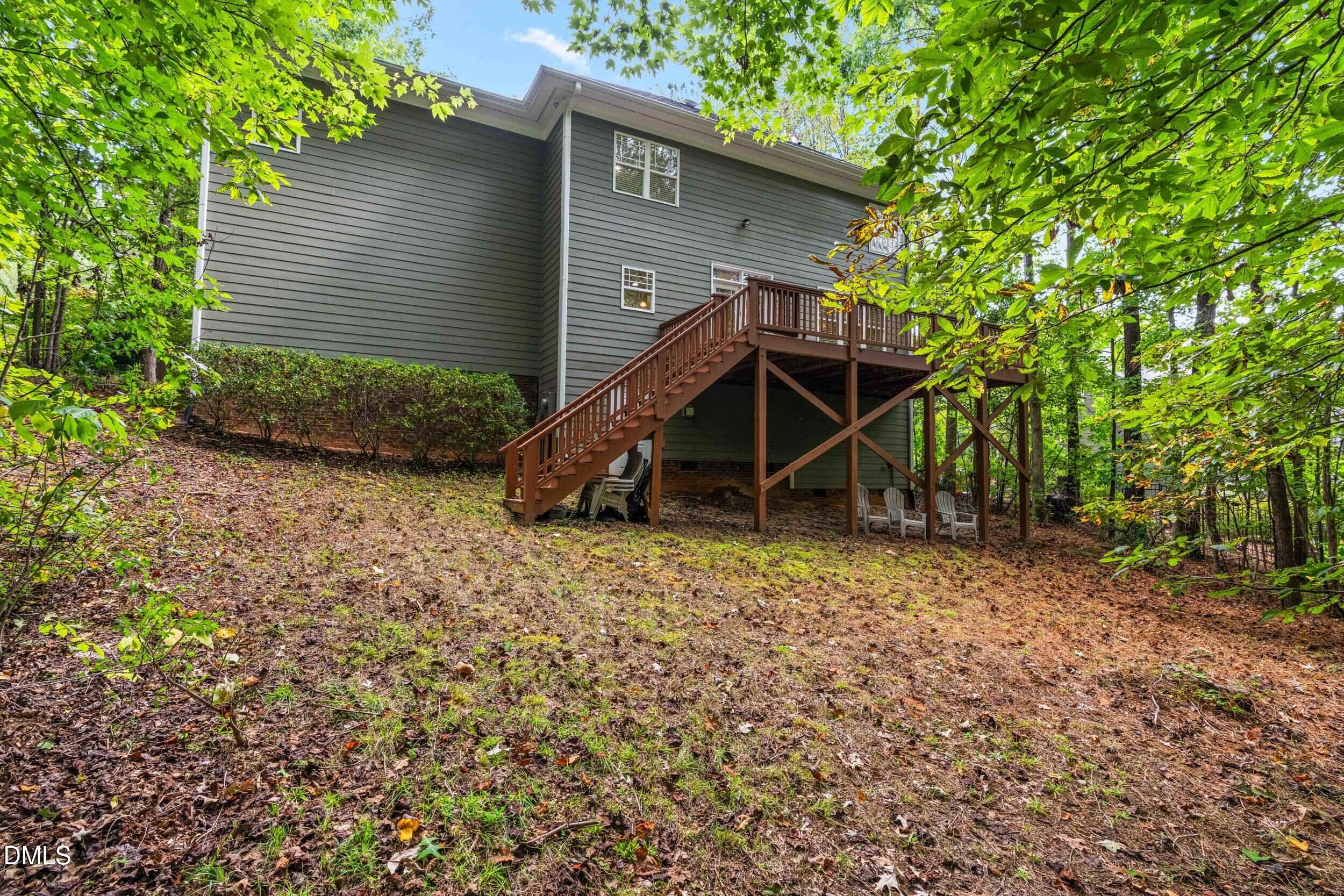 126 Geranium Way Clayton, NC 27527 - Photo 30 of 35 a view of a house with a yard and wooden fence