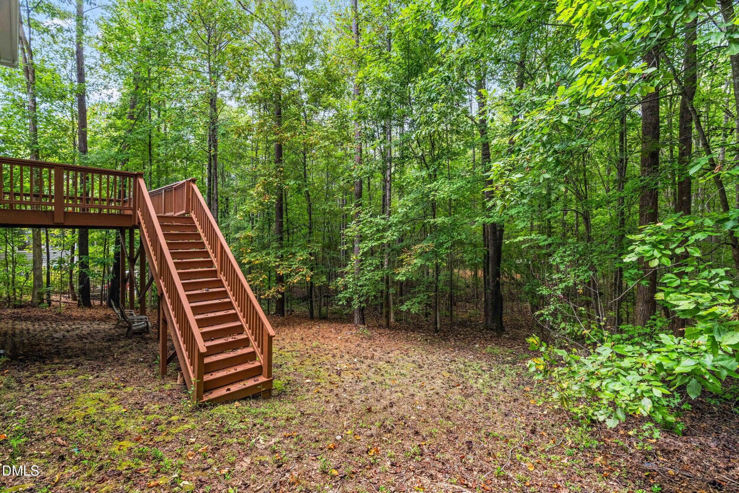 126 Geranium Way Clayton, NC 27527 - Photo 31 of 35 a view of a backyard with a trees