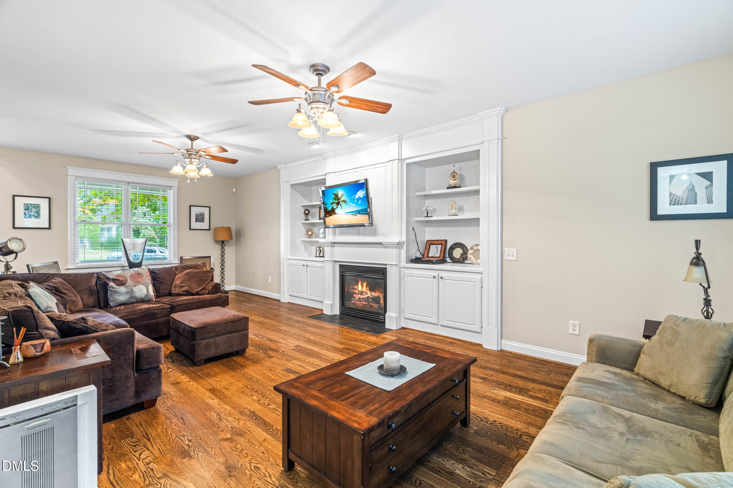 126 Geranium Way Clayton, NC 27527 - Photo 10 of 35 a living room with furniture and a fireplace