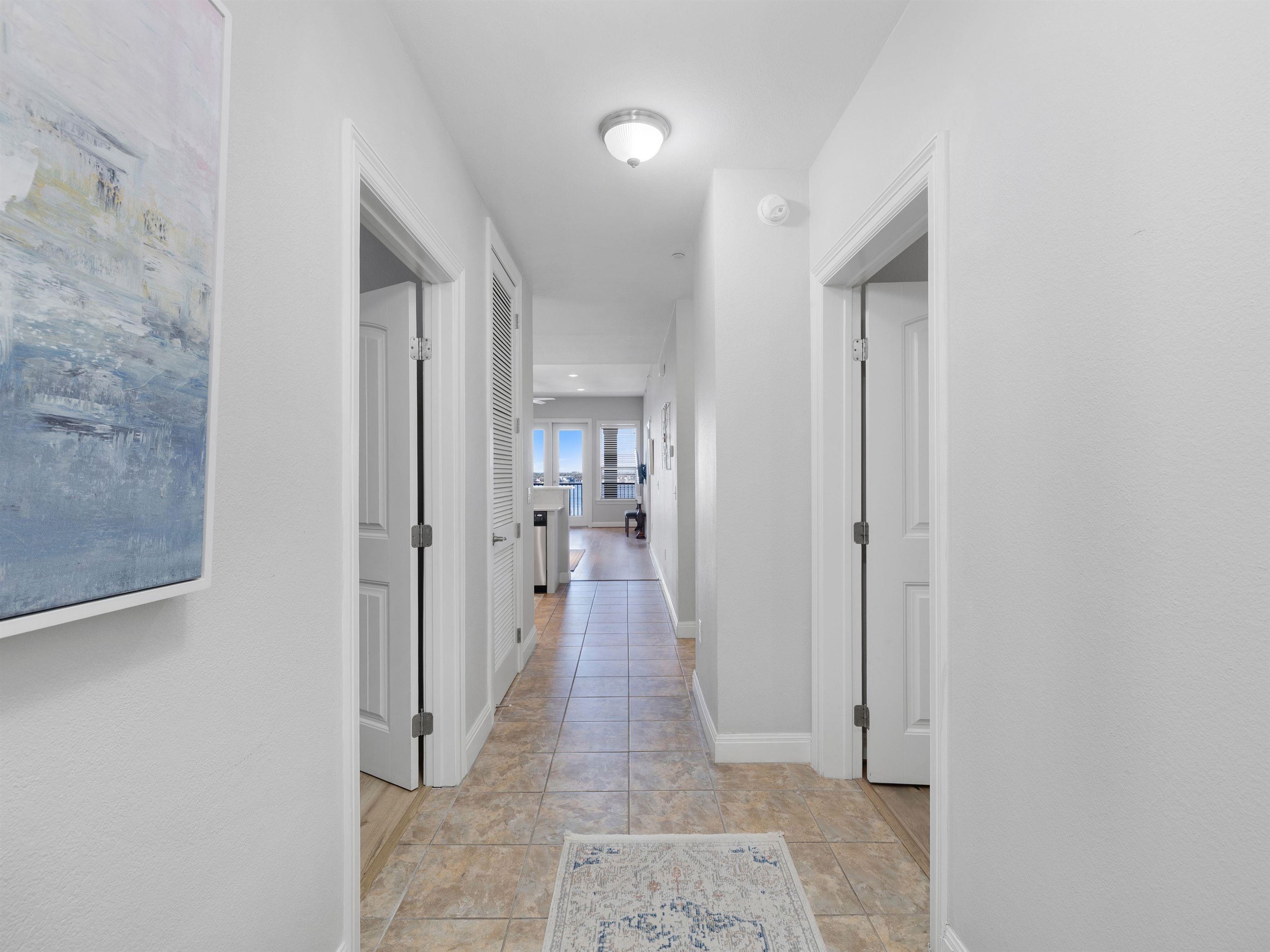 101 West Bank, Unit 44 Horseshoe Bay, TX 78657 - Photo 2 of 22 a view of a hallway with a room and a bathroom