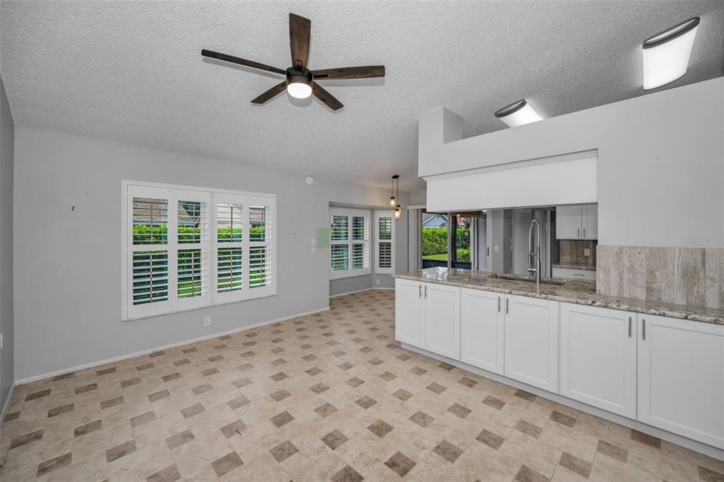 6525 Pine Walk Drive New Port Richey, FL 34655 - Photo 20 of 62 a view of a kitchen with a sink and a window