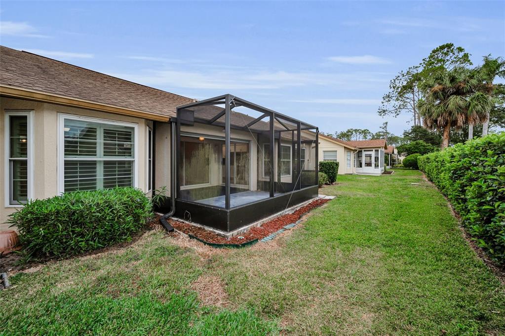 6525 Pine Walk Drive New Port Richey, FL 34655 - Photo 35 of 62 a view of a house with a yard