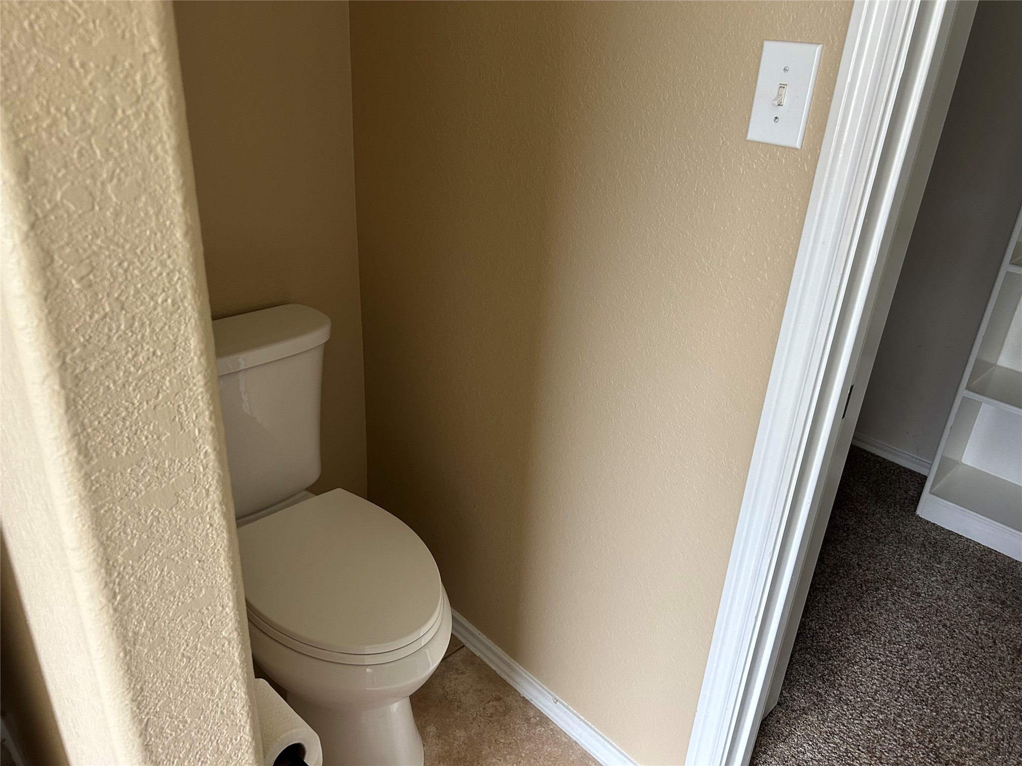25111 Country Gate Drive Tomball, TX 77375 - Photo 17 of 22 a white toilet sitting next to a shower